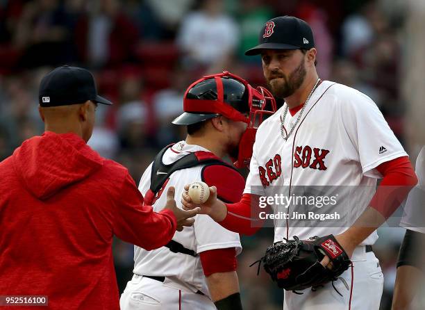 Heath Hembree of the Boston Red Sox is removed after giving up a run in the seventh inning against the Tampa Bay Rays at Fenway Park on April 28,...