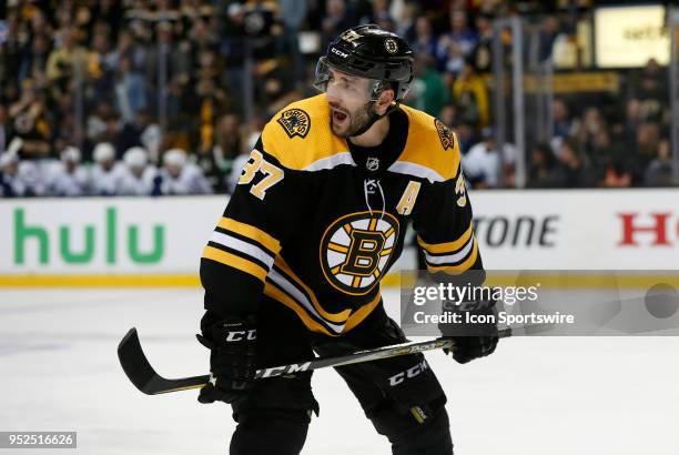 Boston Bruins center Patrice Bergeron moves his point man during Game 5 of the First Round for the 2018 Stanley Cup Playoffs between the Boston...