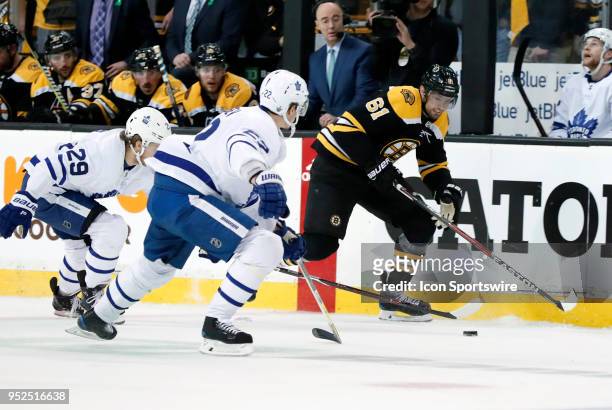 Boston Bruins right wing Rick Nash busts down the wing chased by Toronto Maple Leafs right wing William Nylander and Toronto Maple Leafs defenseman...