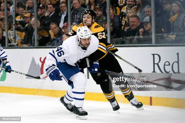 Boston Bruins center Sean Kuraly grabs Toronto Maple Leafs defenseman Roman Polak during Game 5 of the First Round for the 2018 Stanley Cup Playoffs...
