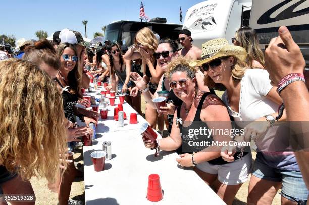 Festivalgoers play beer pong during day 2 of 2018 Stagecoach California's Country Music Festival at the Empire Polo Field on April 28, 2018 in Indio,...