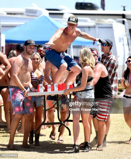 Festivalgoers play beer pong during day 2 of 2018 Stagecoach California's Country Music Festival at the Empire Polo Field on April 28, 2018 in Indio,...