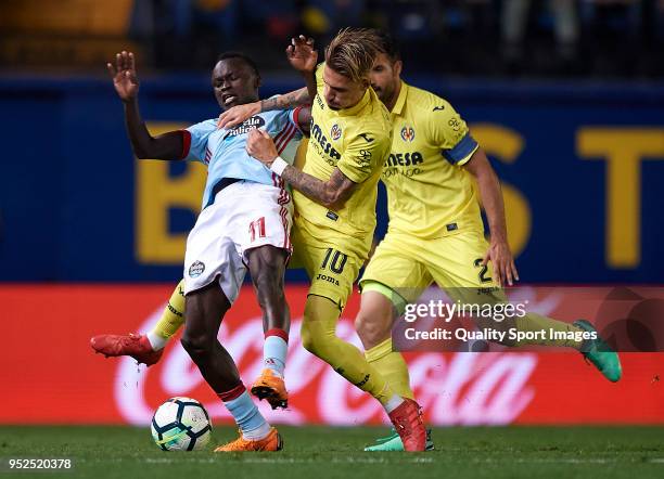 Mario Gaspar and Samuel Castillejo of Villarreal competes for the ball with Pione Sisto of Celta de Vigo during the La Liga match between Villarreal...