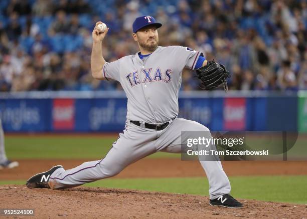 Kevin Jepsen of the Texas Rangers delivers a pitch in the ninth inning during MLB game action against the Toronto Blue Jays at Rogers Centre on April...