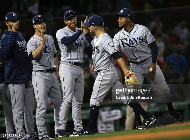 Johnny Field of the Tampa Bay Rays, who had three runs batted in during a 12-6 win over the Boston Red Sox, celebrates with teammates at Fenway Park...