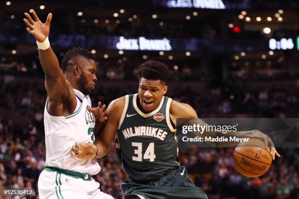 Semi Ojeleye of the Boston Celtics defends Giannis Antetokounmpo of the Milwaukee Bucks during the first quarter of Game Seven in Round One of the...