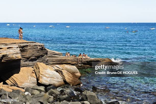 Holidaymakers on the beaches of Le Cap d'Agde on August 08, 2012 in Le Cap d'Agde, Herault, Languedoc-Roussillon, France.