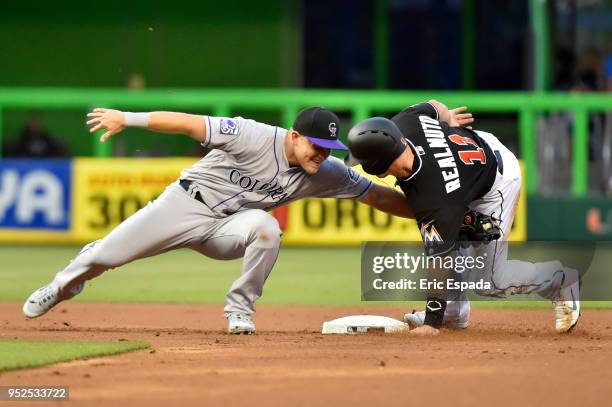Realmuto of the Miami Marlins steals second base during the first inning against the Colorado Rockies at Marlins Park on April 28, 2018 in Miami,...