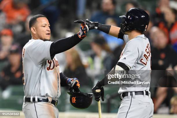 Miguel Cabrera of the Detroit Tigers celebrates a three run home run in the second inning with Nicholas Castellanos during a baseball game against...