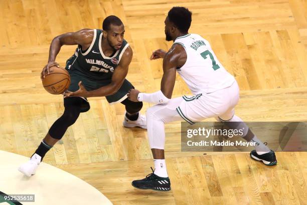 Jaylen Brown of the Boston Celtics defends Khris Middleton of the Milwaukee Bucks during the second quarter of Game Seven in Round One of the 2018...