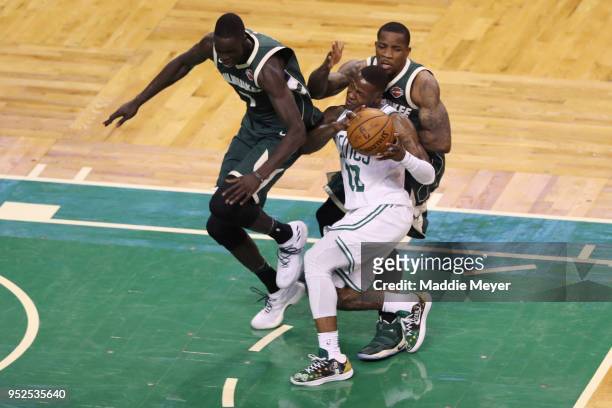 Thon Maker of the Milwaukee Bucks and Eric Bledsoe defend Terry Rozier during the second quarter of Game Seven in Round One of the 2018 NBA Playoffs...