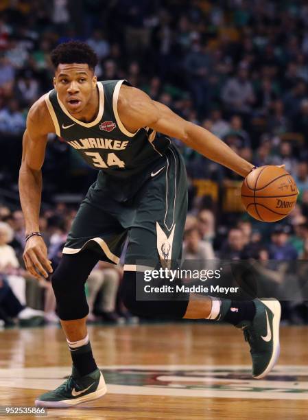 Giannis Antetokounmpo of the Milwaukee Bucks dribbles against the Boston Celtics during the first quarter of Game Seven in Round One of the 2018 NBA...