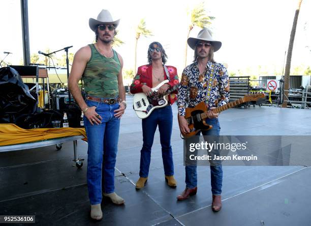 Mark Wystrach, Cameron Duddy and Jess Carson of Midland pose onstage during 2018 Stagecoach California's Country Music Festival at the Empire Polo...