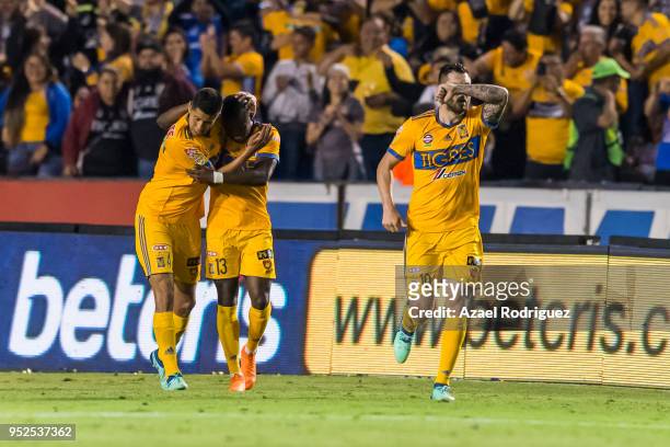 Andre-Pierre Gignac of Tigres celebrates with teammates after scoring his teams second goal during the 17th round match between Tigres UANL and...