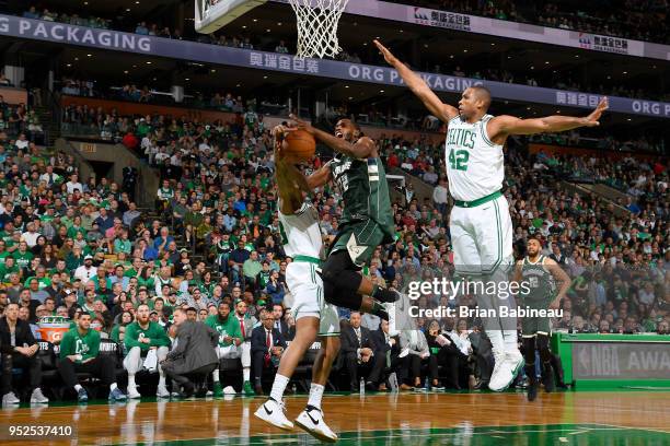 Khris Middleton of the Milwaukee Bucks goes to the basket against the Boston Celtics in Game Seven of Round One of the 2018 NBA. Playoffs on April...