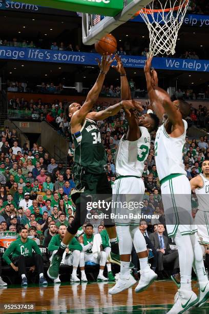 Giannis Antetokounmpo of the Milwaukee Bucks goes to the basket against the Boston Celtics in Game Seven of Round One of the 2018 NBA. Playoffs on...