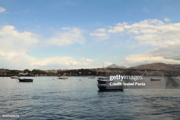 sailboats in sea against sky during sunset - hondarribia stock-fotos und bilder