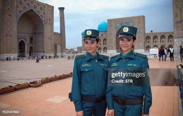 Picture taken on March 28, 2018 shows identical twins Zukhra and Fatima Rakhmatova members of a newly-formed Tourist Police, posing in the famed silk...