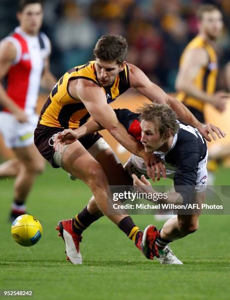 Luke Breust of the Hawks and Jimmy Webster of the Saints compete for the ball during the 2018 AFL round six match between the Hawthorn Hawks and the...