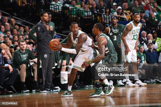 Terry Rozier of the Boston Celtics handles the ball against Eric Bledsoe of the Milwaukee Bucks in Game Seven of Round One of the 2018 NBA. Playoffs...
