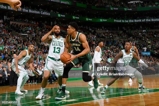 Giannis Antetokounmpo of the Milwaukee Bucks handles the ball against the Boston Celtics in Game Seven of Round One of the 2018 NBA. Playoffs on...