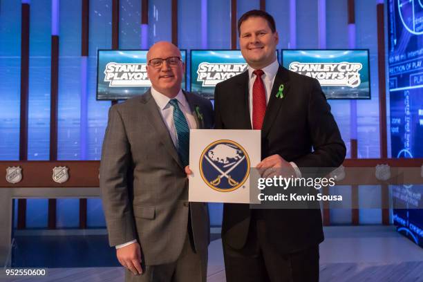 Deputy Commissioner Bill Daly poses with Buffalo Sabres General Manager Jason Botterill after the Buffalo Sabres won the first overall pick during...