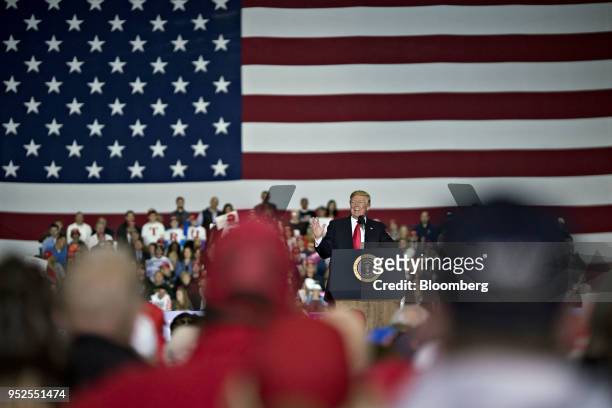 President Donald Trump speaks during a rally in Washington, Michigan, U.S., on Saturday, April 28, 2018. Trump took on most of his usual targets at a...