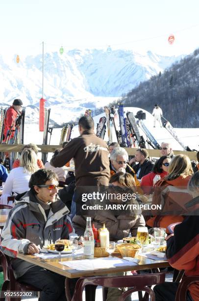 The terrace of La Petite Ferme restaurant, , ski resort of Saint Sorlin d Arves, Les Sybelles skiing area, Maurienne valley, Savoie department, Rhone...