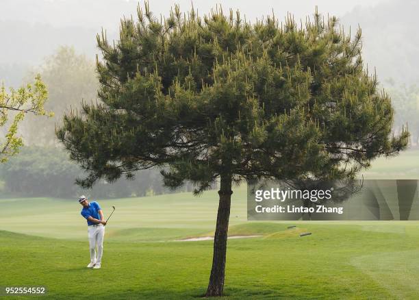 Tapio Pulkkanen of Finland plays a shot during the final round of the 2018 Volvo China Open at Topwin Golf and Country Club on April 29, 2018 in...