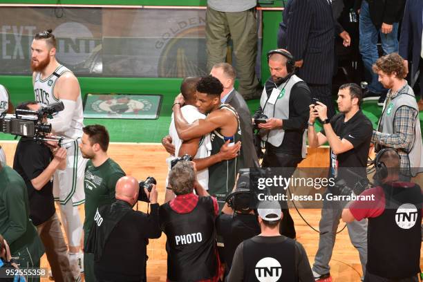 Giannis Antetokounmpo of the Milwaukee Bucks hugs Al Horford of the Boston Celtics after the game between the two teams in Game Seven of the 2018 NBA...