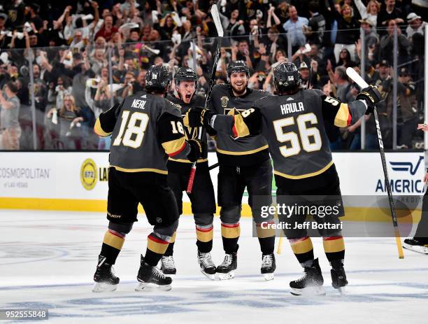 Nate Schmidt of the Vegas Golden Knights celebrates with his teammates James Neal, Shea Theodore and Erik Haula after scoring a goal against the San...