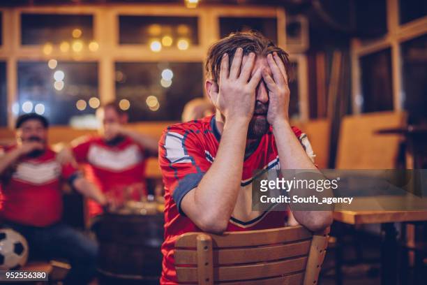 despair soccer fans - jersey soccer stock pictures, royalty-free photos & images