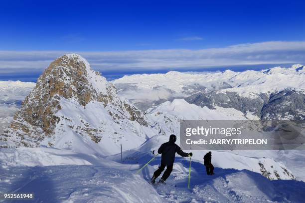 The black difficult ski slope from the top of Saulire mountain, Courchevel 1850 ski resort, Trois Vallees skiing area, Tarentaise valley, Savoie...