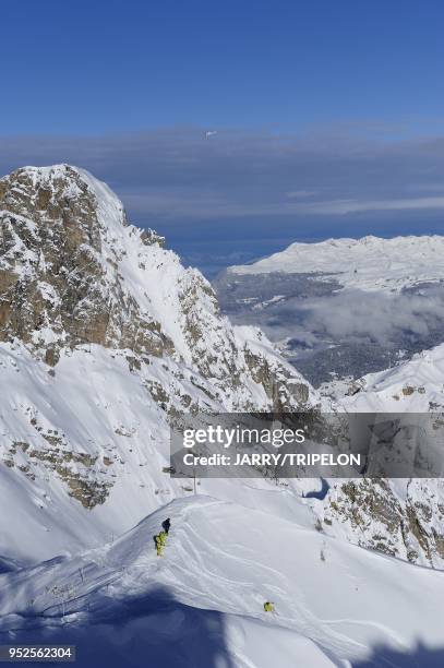 The black difficult ski slope from the top of Saulire mountain, Courchevel 1850 ski resort, Trois Vallees skiing area, Tarentaise valley, Savoie...