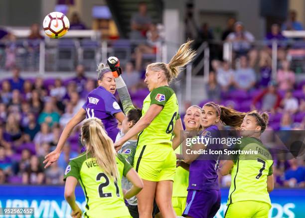 Seattle Reign FC midfielder Allie Long head the ball on a Orlando Pride corner kick during the NWSL soccer match between the Orlando Pride and the...