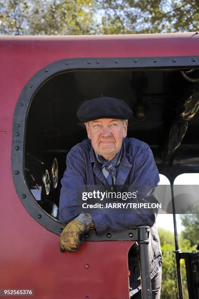 Train driver at the terminus of the narrow gauge Somme Bay Railway or Chemin de Fer de la Baie de Somme, town of Le Crotoy, Baie de Somme and Cote...