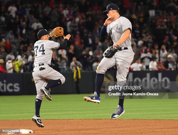 Ronald Torreyes and Aaron Judge of the New York Yankees celebrate after defeating the Los Angeles Angels of Anaheim at Angel Stadium on April 28,...