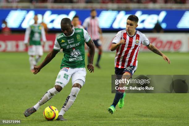 Edson Torres of Chivas fights for the ball with Andres Mosquera of Leon during the 17th round match between Chivas and Leon as part of the Torneo...