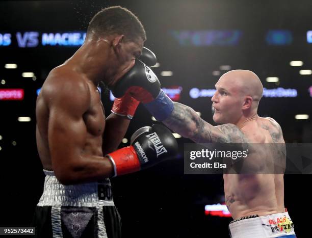 Maciej Sulecki of Poland hits Daniel Jacobs of the USA during their WBA World Middleweight Title bout at Barclays Center on April 28, 2018 in the...