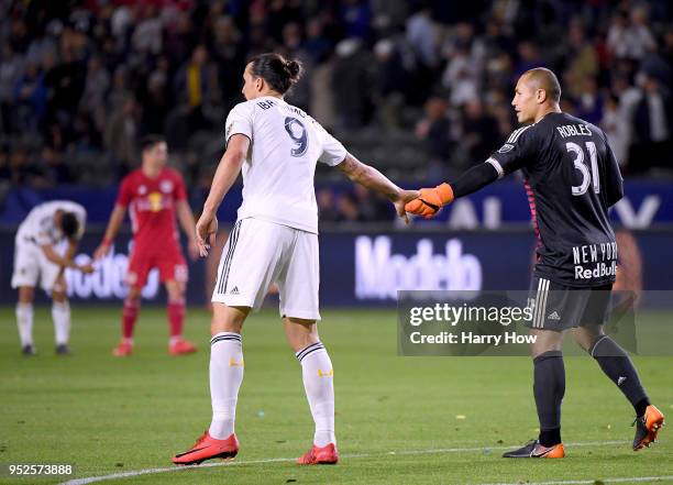 Zlatan Ibrahimovic of Los Angeles Galaxy shakes hands with Luis Robles of New York Red Bulls during the second half of a 3-2 Red Bulls win at StubHub...