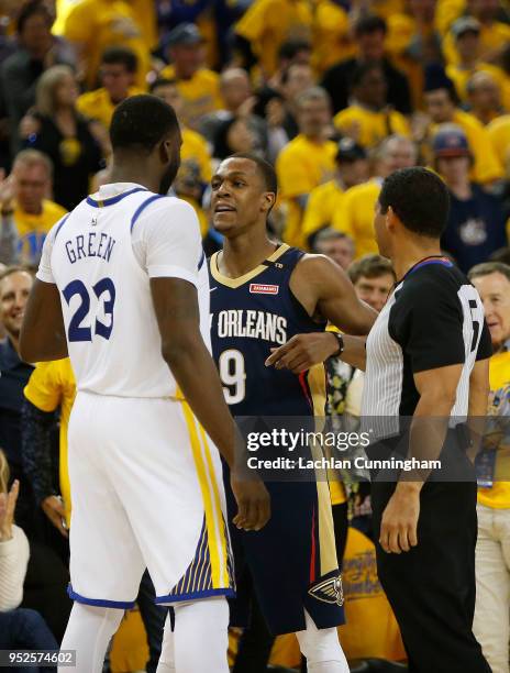 Draymond Green of the Golden State Warriors and Rajon Rondo of the New Orleans Pelicans exchange words during Game One of the Western Conference...