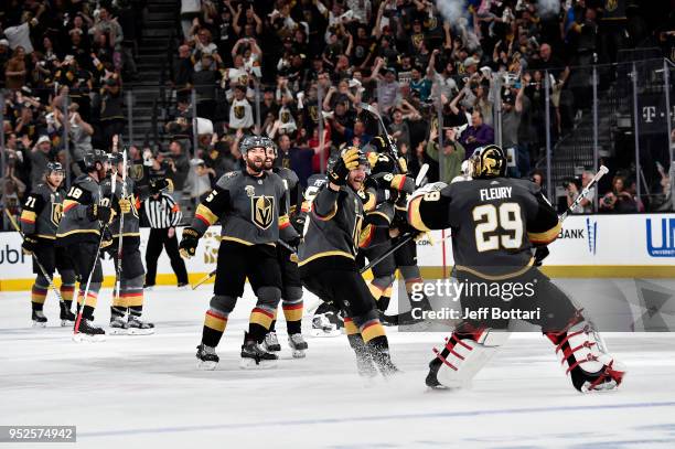 Marc-Andre Fleury of the Vegas Golden Knights celebrates with teammate Colin Miller after thinking they won in overtime against the San Jose Sharks...