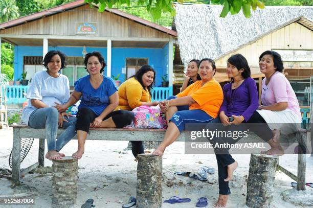 Group of women enjoying a lazy Sunday, Pulau Weh, Banda Aceh, Sumatra, Indonesia.