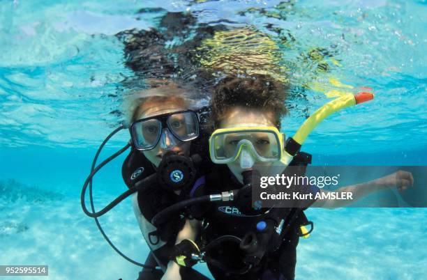 Children, scuba diving, Ari Atoll, Maldives, Indian Ocean.