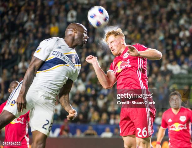 Tim Parker of New York Red Bulls head the ball clear as Michael Ciani of Los Angeles Galaxy tries to get on the end of a cross during the Los Angeles...