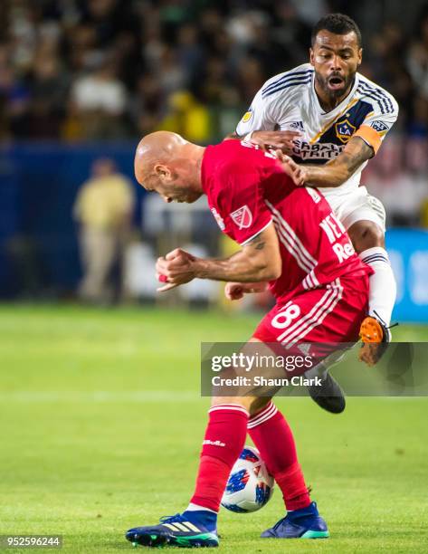 Ashley Cole of Los Angeles Galaxy collides with Aurelien Collin of New York Red Bulls during the Los Angeles Galaxy's MLS match against New York Red...