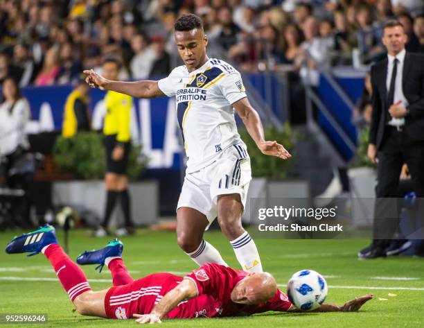 Ola Kamara of Los Angeles Galaxy is defended by Aurelien Collin of New York Red Bulls during the Los Angeles Galaxy's MLS match against New York Red...