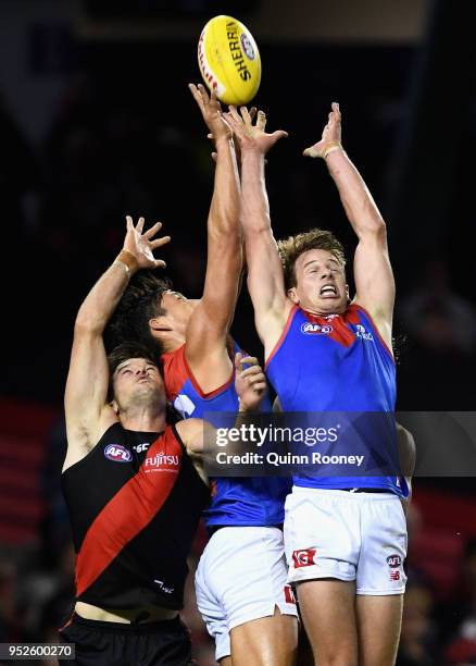 Mitch Hannan of the Demons attempts to mark during the round 6 AFL match between the Essendon Bombers and Melbourne Demons at Etihad Stadium on April...