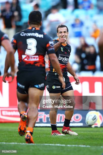 Corey Thompson of the Tigers celebrates scoring a try during the round Eight NRL match between the Parramatta Eels and the Wests Tigers at ANZ...