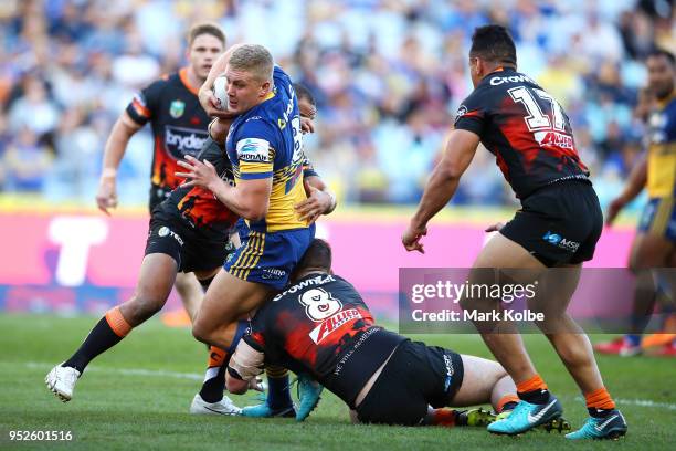 Daniel Alvaro of the Eels is tackled during the round Eight NRL match between the Parramatta Eels and the Wests Tigers at ANZ Stadium on April 29,...